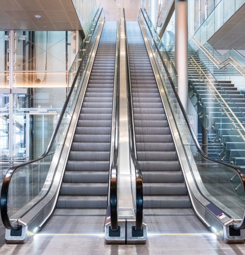 Modern luxury escalators with staircase at airport